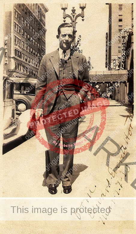 Edward Everett Horton across from the Vine Street Theater in March 1930. B. H. Dyas Department store is seen in the upper left and the Brown Derby on the right.